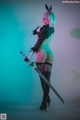 A woman in a bunny costume holding a sword.